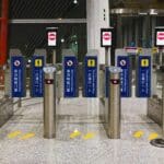 Automated security gates in a modern building entrance.