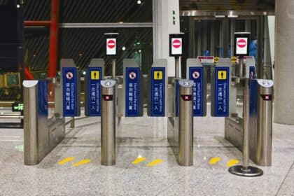 Automated security gates in a modern building entrance.